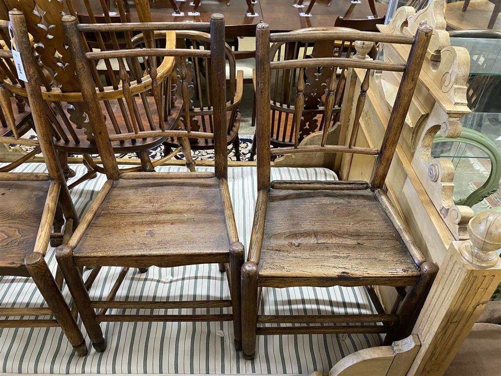 A set of four 19th century provincial ash and elm wood seat dining chairs